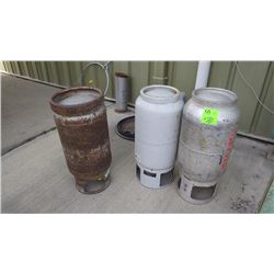 3 empty propane tanks
