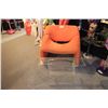 Image 1 : ORANGE MODERN OCCATIONAL CHAIR AND CLEAR PLASTIC READING TABLE