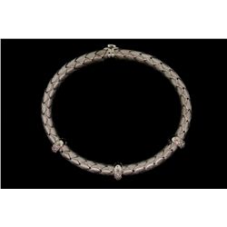 BRACELET:  [1] 18KWG flex bangle bracelet by Roberto Coin with a blue sapphire clasp and set with 48