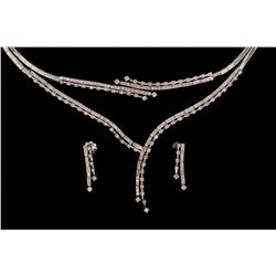 SUITE:  [1] 18KWG suite with matching necklace, bracelet and earrings set with 337 round diamonds, a