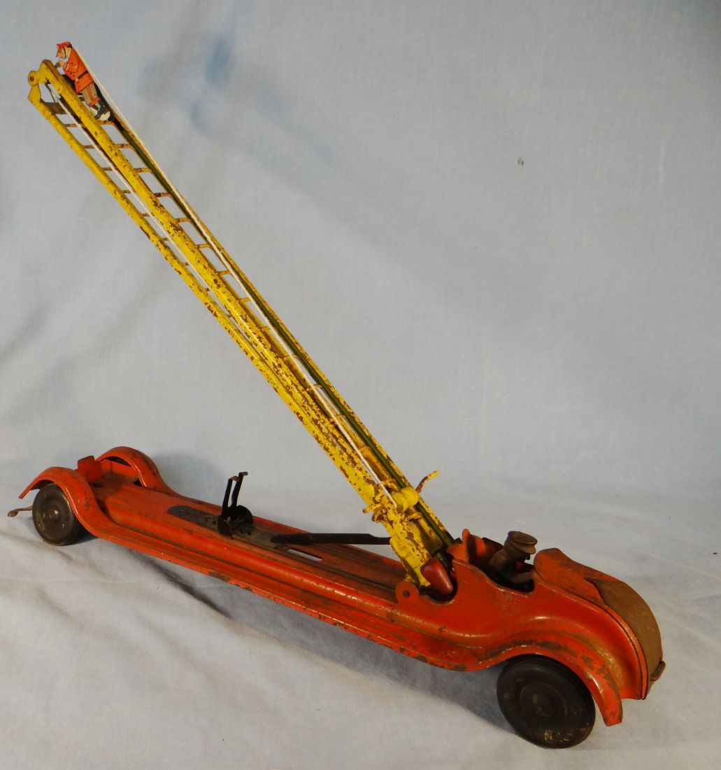 Kingsbury Toys fire truck, with ladderclimbing fireman, very old