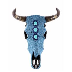 Turquoise Covered Steer Cow Skull The lot shows a