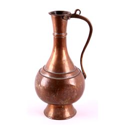 Antique Copper Pitcher This lot features an antiqu