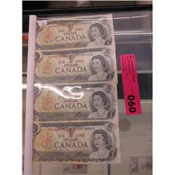 Four old Canada $1 bills