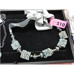 Festive beaded necklace with ribbon
