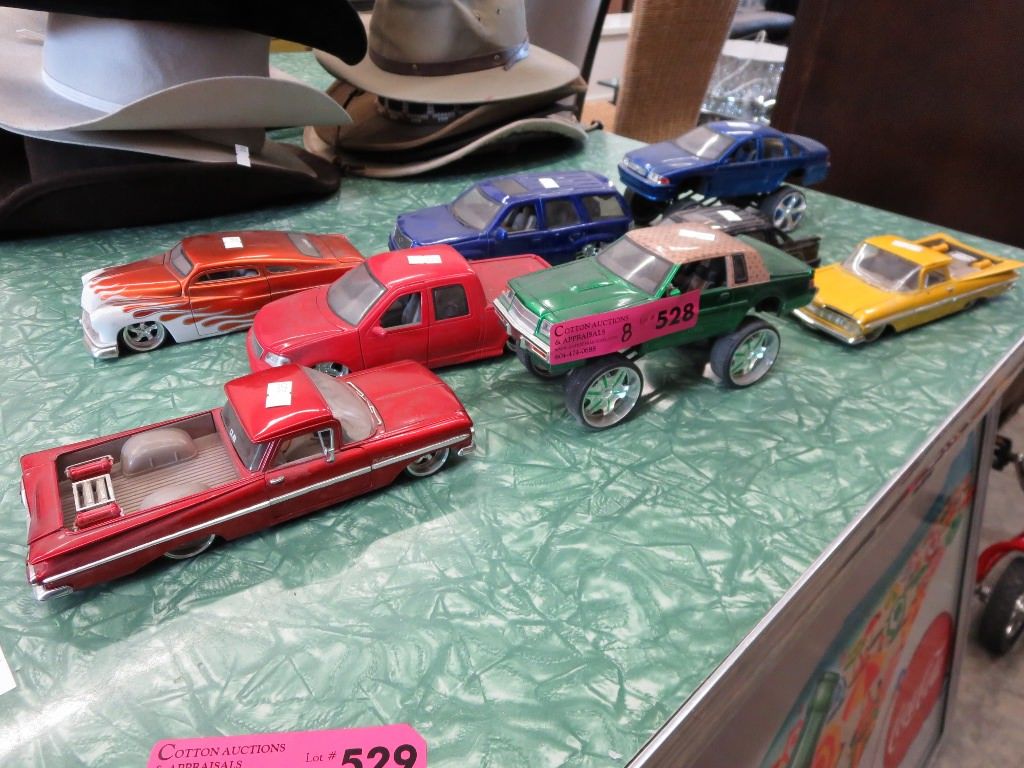 8 Scale model vehicles.