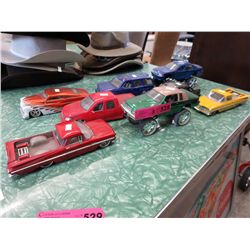 8 Scale model vehicles.