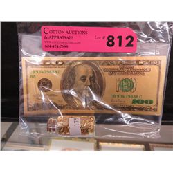 Gold foil bill & vial of gold leaf