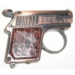 VINTAGE LIGHTER GUN STAMPED *97-7* COPPER COLOR AND IS IN WORKING GOOD CONDITION!! LIGHTER CAME OUT