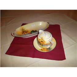 Handpainted pieces of china. 1 creamer with saucer set; 1 serving bowl