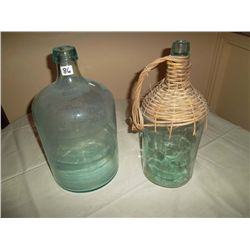 Green bottle with wicker woven on top; 1 matching bottle