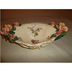 Porcelain flower adorned bowl in pristine condition