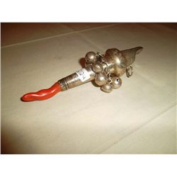 Georgian sterling silver baby rattle. Coral end for teething (coral thought to protect baby). Bells 