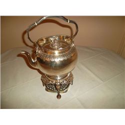 Silver teapot and heating trivet with burner