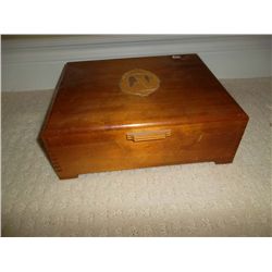 Wooden box with contrasting wood silhouette on top