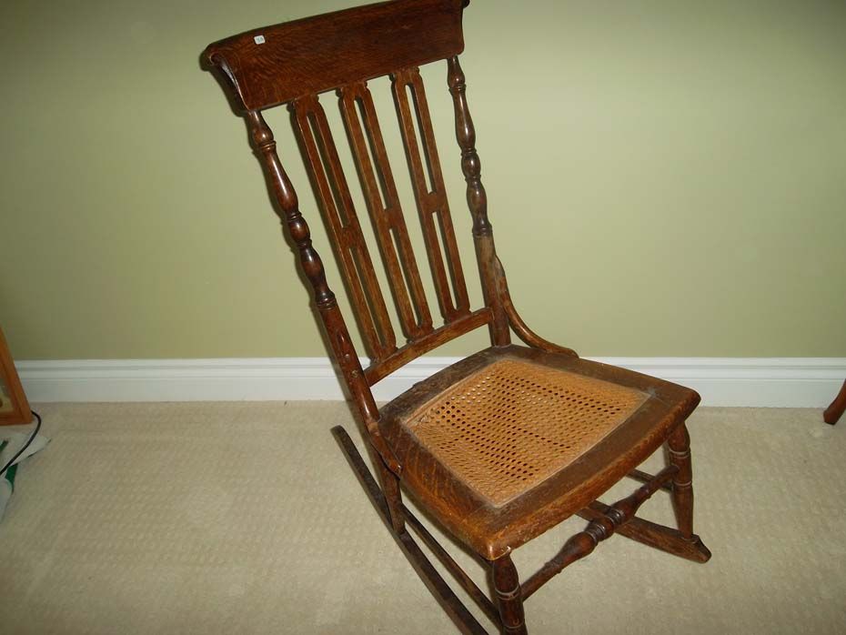 Oak rocking chair with cane or reed seat - Bodnarus Auctioneering