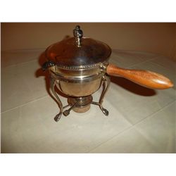 Silver sauce pan with warming burner