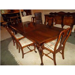 Dining room table with 2 leaves.  6 matching chairs