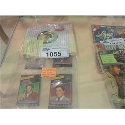 4 UNOPENED PACKAGES OF ELVIS PRESLEY TRADING CARDS AND 11 45 RPM RECORDS