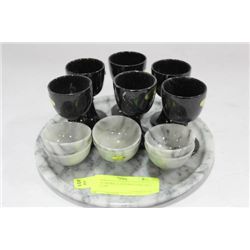 SET OF MARBLE EGG HOLDERS AND TEA CUPS