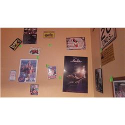 Harley Davidson metal sign, Red Ryder Action Bar metal sign, Sask Hawls 200-2001 poster and Aladdin 