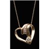 Image 2 : One 14k yellow gold heart shaped slider pendant  set with a 0.40ct diamond and 6 side diamonds  weig