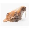 Image 2 : Fossilized marine ivory carvings (2) including a  small Walrus and a seal.     Est.:  $250-$500.