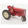 Image 1 : Metal toy tractor with considerable original red  paint remaining, rubber tires; overall good to  ve