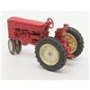 Image 2 : Metal toy tractor with considerable original red  paint remaining, rubber tires; overall good to  ve