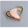 Image 1 : One beautifully carved fish in salmon color coral  set in 14 yellow gold heart shaped pendant with  