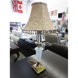 Table lamp with glass insert in base