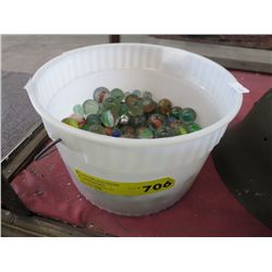Half full pail of marbles