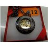 Image 2 : Brand new 2-sided mechanical skeleton pocket watch