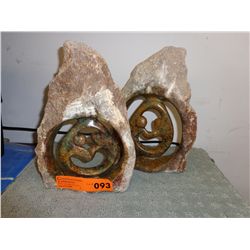 2 Carved stone statues