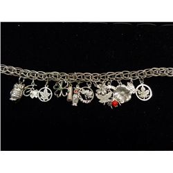 Sterling silver charm bracelet with 13 charms