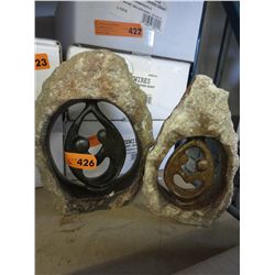 2 Carved stone statues