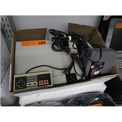 Vintage Nintendo with games & controllers