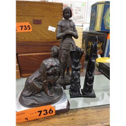 Four decorative statues
