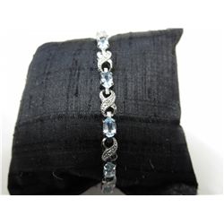 Blue topaz & diamond Infinity design bracelet