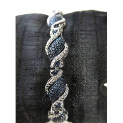 Twist style Tennis bracelet with 25 blue & white diamonds