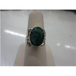 Sterling silver ring set with oval green emerald