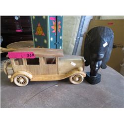 Wood model of a car & a carved African bust