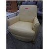 Image 1 : Butter yellow leather swivel chair