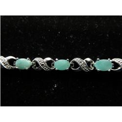 Stunning 6 CT diamond & emerald tennis bracelet