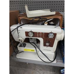 Janome portable sewing machine with case.