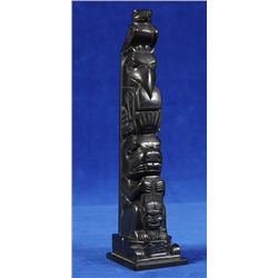 Tom Hans Argillite Totem Carved with Eagle, Raven Holding Copper and Beaver on a Frog Base 7 1/4" H.
