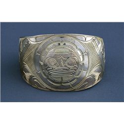 Northwest Coast Silver Bracelet with Incised Sun and Raven Design Marked TJH 6 1/4" L. 1 3/4" W. 1" 