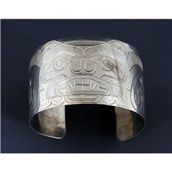 Kwakwaka'wakw Silver Bracelet with Incised Bear Design by William Cook 6 1/8" L. 1 1/2" W. 1 1/8" W.