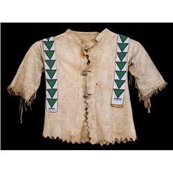 Child's Doeskin Shirt, Hand Sewn with Beaded Strips, Geometric Design ca. 1900 and a Beaded Medallio