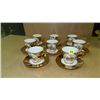 Image 1 : group of gold plated cups and saucers with people